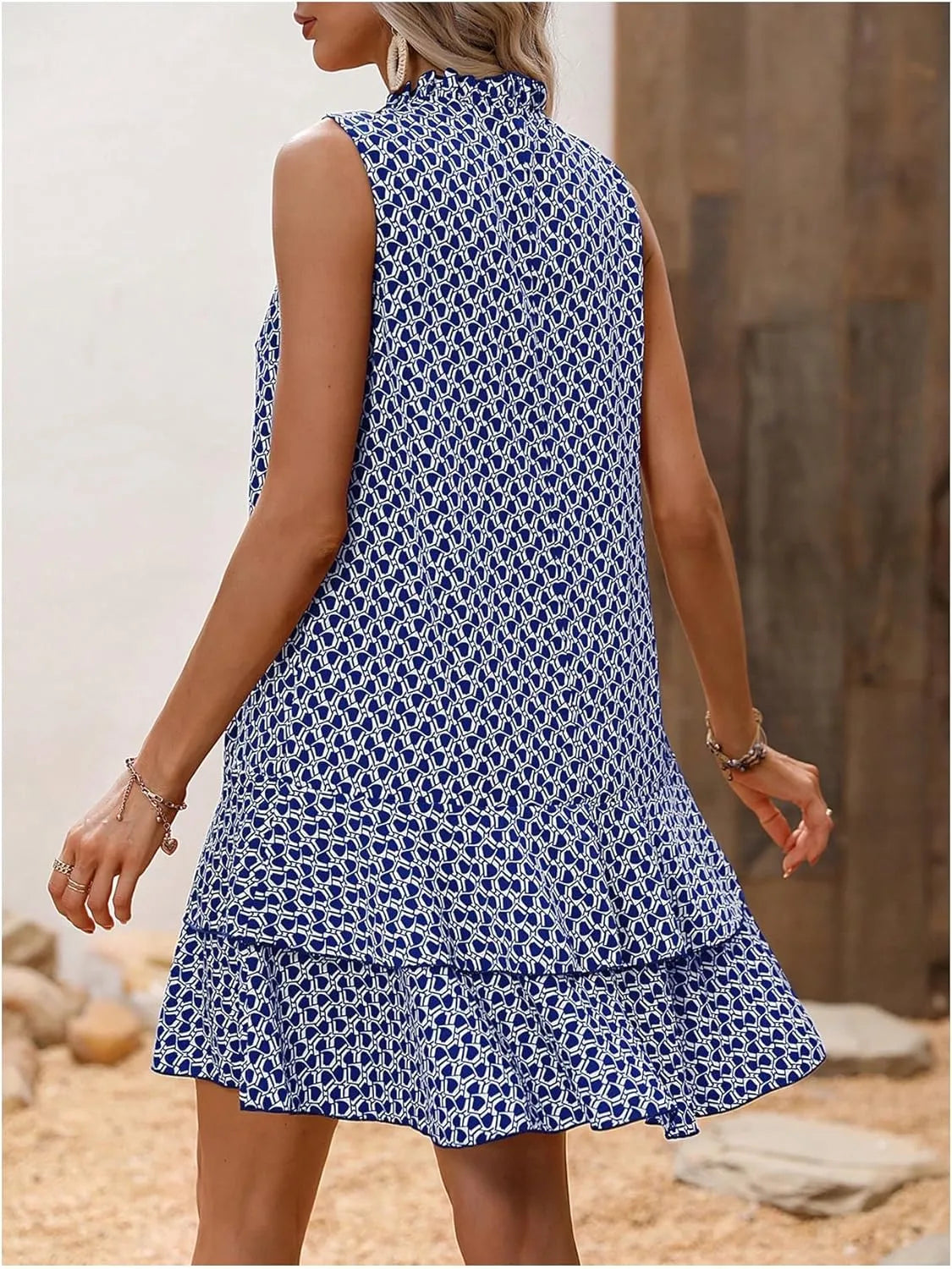 Inés - Elegant printed sleeveless dress with a flowing drape